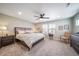 Spacious main bedroom with a ceiling fan, ample natural light, and neutral tones at 11450 Booth Falls Ct, Parker, CO 80134