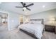 Main bedroom featuring a ceiling fan, ensuite bathroom, and neutral decor at 11450 Booth Falls Ct, Parker, CO 80134