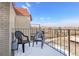 Snowy balcony with chairs and a view of the neighborhood at 7801 W 35Th Ave # 409, Wheat Ridge, CO 80033