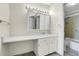 Bathroom with a large vanity, mirror with lighting and a shower/tub combo at 7801 W 35Th Ave # 409, Wheat Ridge, CO 80033