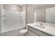 Bathroom featuring a white tiled shower/tub, toilet, and a white vanity at 1854 Westport Ave, Berthoud, CO 80513