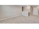 A cozy bedroom upstairs is enhanced with neutral carpet flooring and paint at 1854 Westport Ave, Berthoud, CO 80513