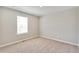 A simple bedroom that includes neutral paint, carpet, and a window at 1854 Westport Ave, Berthoud, CO 80513