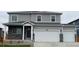 Charming two-story home featuring a three-car garage and a well-maintained front yard at 1854 Westport Ave, Berthoud, CO 80513