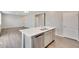 A modern kitchen with stainless steel appliances, gray cabinetry and a light countertop at 1854 Westport Ave, Berthoud, CO 80513