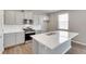Modern kitchen with stainless steel appliances and white countertops, perfect for cooking and entertaining at 1854 Westport Ave, Berthoud, CO 80513