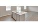 Modern kitchen with stainless steel appliances and white countertops and plenty of cabinet storage at 1854 Westport Ave, Berthoud, CO 80513