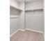 A walk-in closet has carpet flooring and clothing racks at 1854 Westport Ave, Berthoud, CO 80513