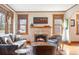 Cozy living room featuring a fireplace, hardwood floors, and a comfortable seating area at 983 S Josephine St, Denver, CO 80209