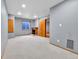 Basement area with new carpeting, charming fireplace, and built in storage at 5885 Kingsfield St, Castle Rock, CO 80104