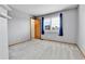 Bedroom with carpet, gray walls, natural light, and closet at 5885 Kingsfield St, Castle Rock, CO 80104