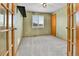 Charming bedroom with glass panel doors, carpeted floor, and window at 5885 Kingsfield St, Castle Rock, CO 80104