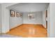 Elegant dining room with hardwood floors, a chandelier, and a large window with blinds at 5885 Kingsfield St, Castle Rock, CO 80104