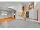 Open foyer with wood and tile flooring, featuring a staircase with wood railings at 5885 Kingsfield St, Castle Rock, CO 80104