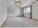 Spacious main bedroom features vaulted ceilings, a ceiling fan, and a large window at 5885 Kingsfield St, Castle Rock, CO 80104