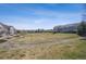 Community green space with walking path, open lawn and mature landscaping at 12728 Jasmine St # E, Thornton, CO 80602