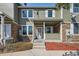 Charming two-story home with a welcoming front porch and a well-maintained front yard at 12728 Jasmine St # E, Thornton, CO 80602
