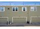 Exterior garage view of modern townhome at 12728 Jasmine St # E, Thornton, CO 80602