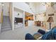 Spacious living area with stairs and open access to the kitchen and dining areas, great for entertaining at 12728 Jasmine St # E, Thornton, CO 80602