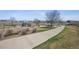 Community playground area with a lake, picnic shelter and play equipment at 12728 Jasmine St # E, Thornton, CO 80602