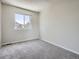 Bright bedroom featuring neutral carpet, a window for natural light, and painted walls at 17014 Carr Ave, Parker, CO 80134