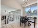 Well-lit dining room with contemporary light fixture and large window at 17014 Carr Ave, Parker, CO 80134