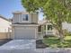 Charming two-story home with a two-car garage and a well-manicured front yard at 17014 Carr Ave, Parker, CO 80134