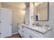 Elegant bathroom with dual sinks, granite countertops, and modern fixtures at 7455 E Quincy Ave # 103, Denver, CO 80237