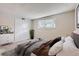 Serene bedroom with neutral tones, closet, and a cozy atmosphere for relaxation at 7455 E Quincy Ave # 103, Denver, CO 80237