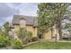 Inviting exterior showcasing a well-maintained building with a lush lawn and mature trees at 7455 E Quincy Ave # 103, Denver, CO 80237