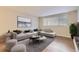Stylishly staged living room with a comfortable sofa, area rug, and ample natural light at 7455 E Quincy Ave # 103, Denver, CO 80237