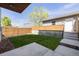 The home features a cozy backyard, a concrete patio, and stairs leading to a back entrance at 2004 S Galapago St, Denver, CO 80223