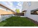The home has a well-maintained grassy backyard, complete with a patio and privacy fence at 2004 S Galapago St, Denver, CO 80223