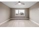 Well-lit bedroom with light wood floors and a large window at 2004 S Galapago St, Denver, CO 80223