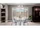 Charming dining area featuring a modern table, stylish chairs and natural light from a large window at 2004 S Galapago St, Denver, CO 80223