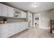 Hallway with lots of storage cabinets and drawers near the staircase at 2004 S Galapago St, Denver, CO 80223