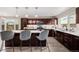 Spacious kitchen features a center island with seating, granite countertops, and modern appliances at 2004 S Galapago St, Denver, CO 80223