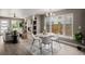Bright living space with a fireplace, dining area, and comfortable seating creating a cozy and inviting atmosphere at 2004 S Galapago St, Denver, CO 80223