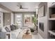 Bright living room featuring stylish furnishings, fireplace with built-ins, and abundant natural light creating a cozy atmosphere at 2004 S Galapago St, Denver, CO 80223