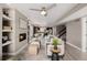 Open concept living room with fireplace, connecting seamlessly to the dining and kitchen areas, ideal for modern living at 2004 S Galapago St, Denver, CO 80223