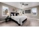 Well-lit main bedroom with two windows, modern decor, ceiling fan, and comfortable furnishings at 2004 S Galapago St, Denver, CO 80223