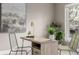 Close up of the office desk area with modern decor, plants, and natural light at 2004 S Galapago St, Denver, CO 80223