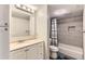 Clean bathroom with a shower-tub combo, modern vanity, and ample lighting at 8100 W Quincy Ave # 11, Denver, CO 80123