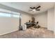 Well-lit bedroom with a ceiling fan and carpeted floors, perfect for a home office or guest room at 8100 W Quincy Ave # 11, Denver, CO 80123