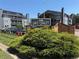 Lake Chalet community sign, with beautiful shrubbery and buildings in the background on a sunny day at 8100 W Quincy Ave # 11, Denver, CO 80123