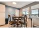 Charming dining area with a round table, four chairs, and a view of the outdoors at 8100 W Quincy Ave # 11, Denver, CO 80123