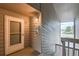 Unit entryway with security door and views of the community at 8100 W Quincy Ave # 11, Denver, CO 80123