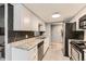 Well-equipped kitchen featuring stainless steel appliances, granite countertops, and ample cabinet space at 8100 W Quincy Ave # 11, Denver, CO 80123