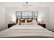 Spacious bedroom with a large bed, bedside tables and lamps, and a relaxing feel at 1223 Race St # 101, Denver, CO 80206