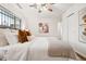 Comfortable and cozy bedroom with a large bed and neutral, calm colors at 1223 Race St # 101, Denver, CO 80206